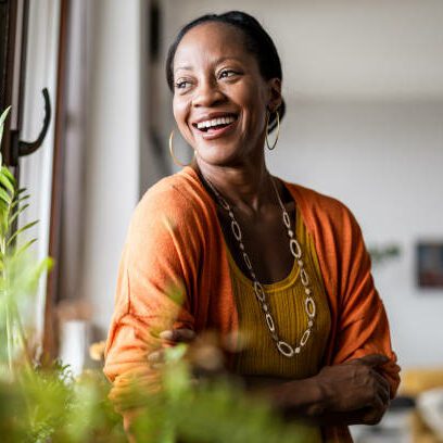 Portrait of a smiling mature woman standing in her
